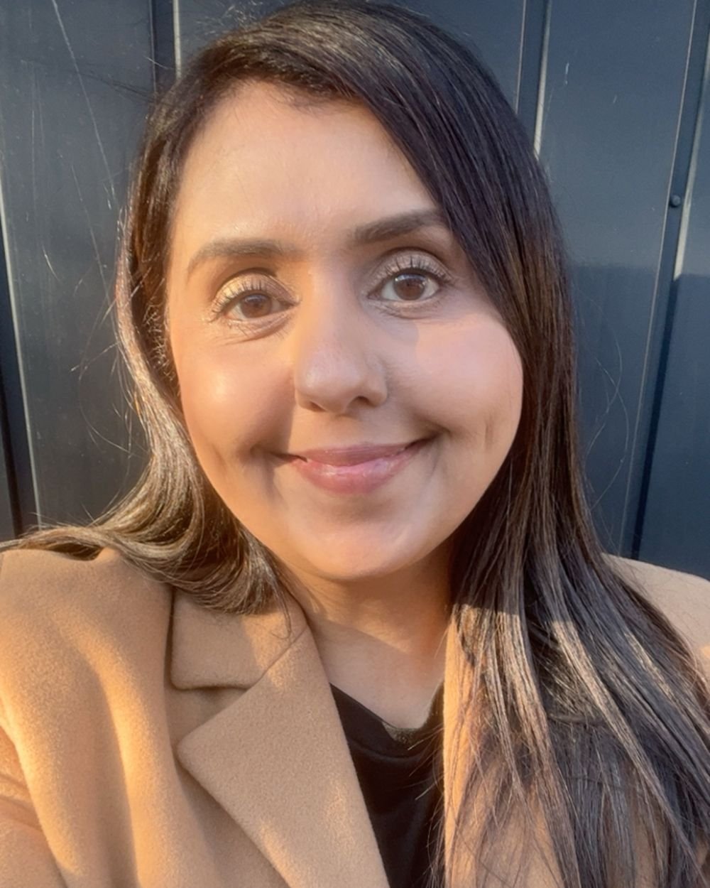 Humma smiling in warm evening light